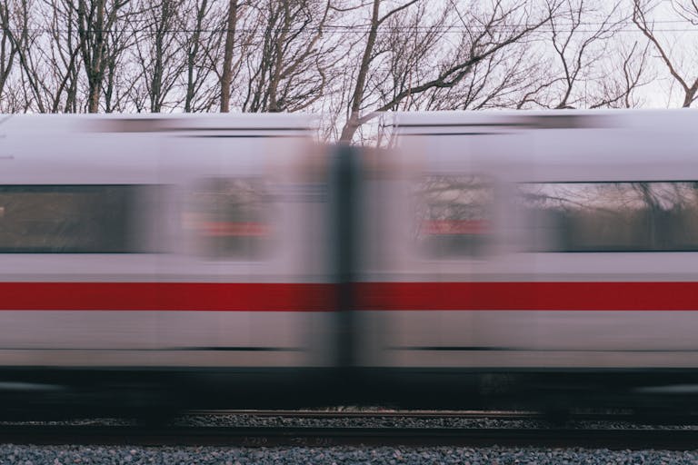 Blurred motion of a high-speed train passing through Dortmund in winter. Dynamic and modern transportation.
