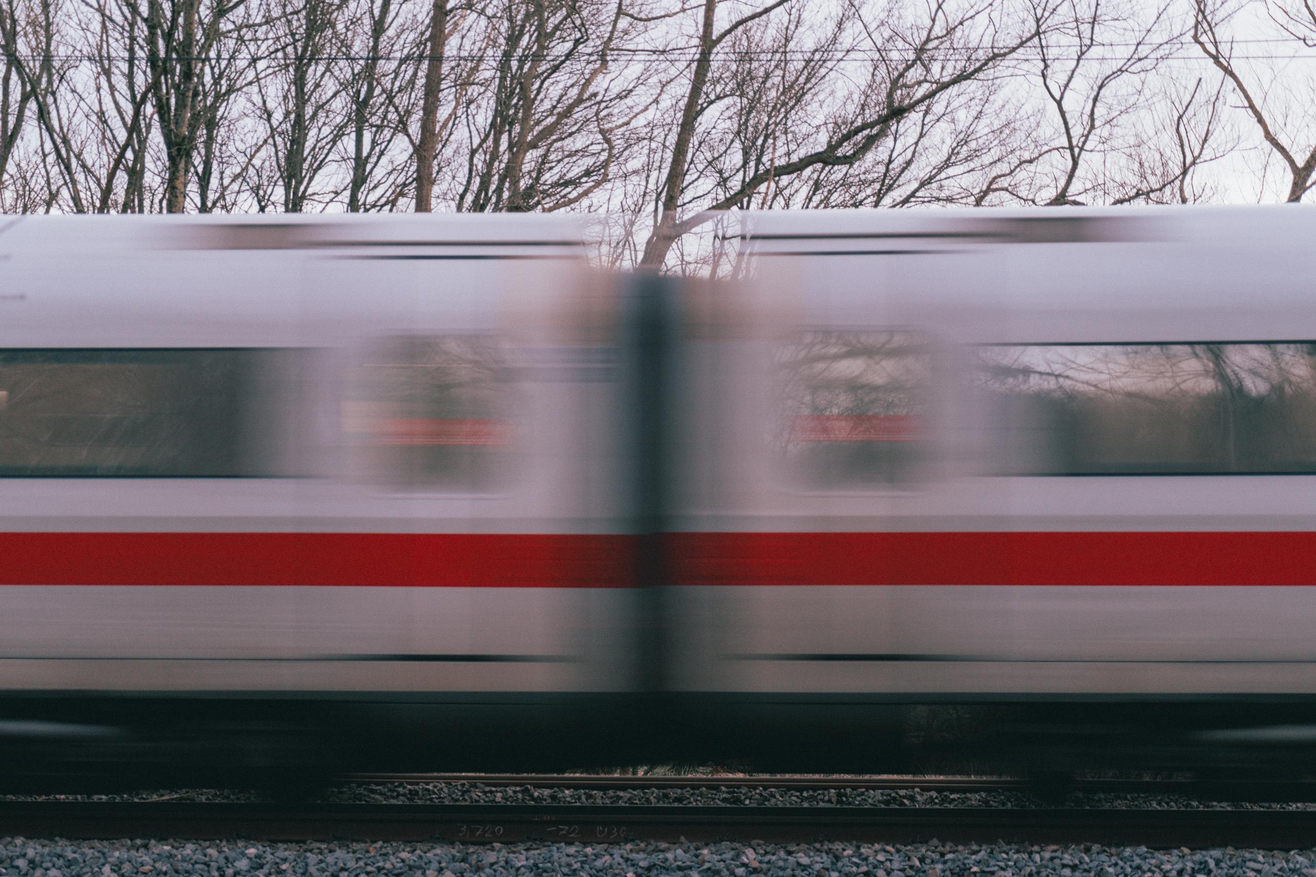 Blurred motion of a high-speed train passing through Dortmund in winter. Dynamic and modern transportation.